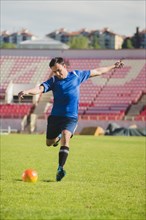 Football player shooting kick