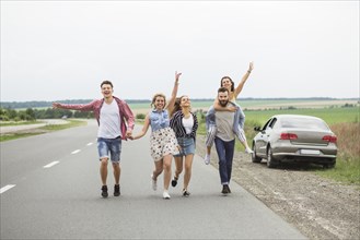 Group friends enjoying road