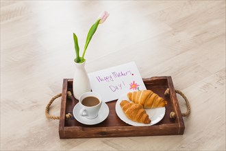 Happy mothers day inscription with coffee tray