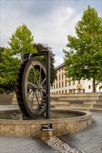 Mill wheel fountain in front of the residence