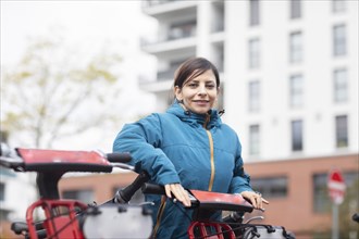 Woman uses a hire bike in the city Environmental protection