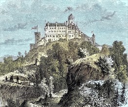Die Wartburg ueber der Stadt Eisenach in Thueringen