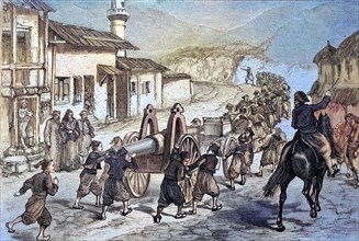 Turkish children pulling a Krupp canon through a village at Erzurum to their destination