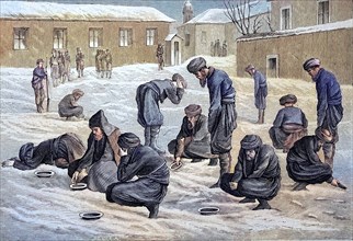 Turkish prisoners in Russia perform their ablutions and prayers in the snow-covered courtyard