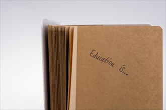 'Education is...' written on a notebook