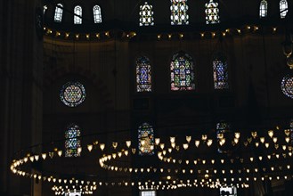 Bright Lamps on circular chandelier in a big mosque