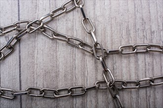 Chain made of silver color metal on grey background
