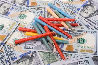 Birthday candles is placed on spread US dollar banknotes