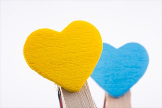 Yellow and blue hearted clips together