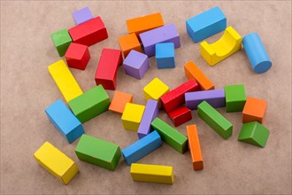 Colorful building blocks on a brown background