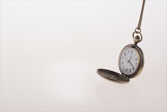 Isolated retro styled pocket watch on white background