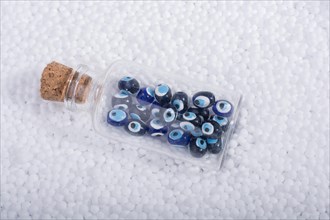 Turkish evil eye beads on white polystyrene foam balls