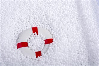 Lifesaver on little white polystyrene foam balls
