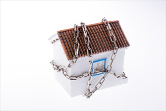 House in chains on a white background