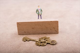 Figurine standing behind retro styled key