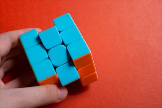 Rubik's cube in female hands. problem solving