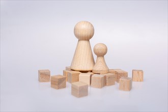 Wooden figurines of family as concept of caring for children