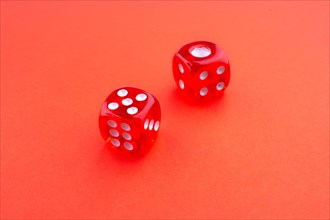 Red dice on a red background