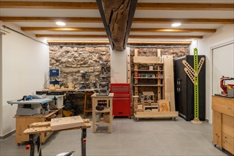 Interior space of a printing press studio equipped with tools and furniture