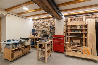 Interior space of a printing press studio with no people equipped with tools and furniture