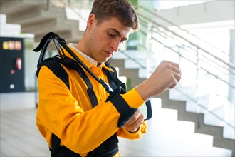 Employee with an exoskeleton from a futuristic high-tech warehouse