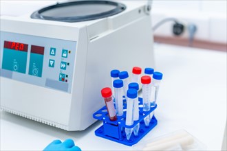 Close-up of a centrifuge machine and blood samples in an innovative laboratory