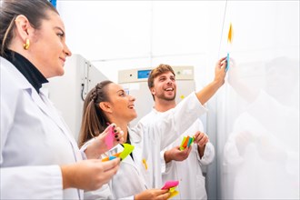 Group of young scientist during a creative process in a cancer research laboratory