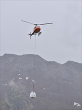 Aerospatiale 350B3 Ecureuil helicopter from the Air Service Centre on a supply flight to the Magdeburger Huette in the Stubai Alps