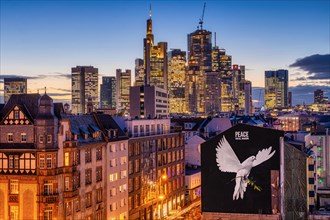 PEACE FOR ALL MANKIND is written above the image of a giant dove of peace on the wall of a house in Frankfurt am Main: a message of peace in the contemporary historical context of the escalated Middle...