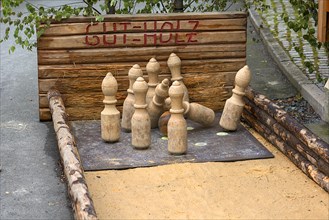 Historical sand skittle alley with wooden ball and wooden skittle
