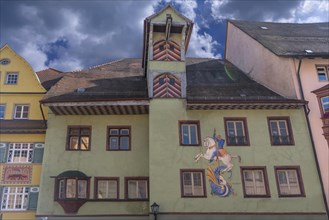 Historic town house with tower and mural painted by Bernhard Waeschle in 1954