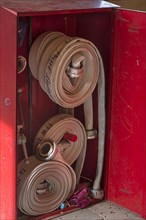 Cabinet with fire hoses from the volunteer fire brigade in a bus stop