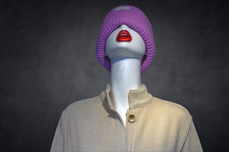 Mannequin with knitted hat in a fashion shop