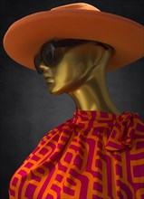 Mannequin with hat and sunglasses in a fashion shop