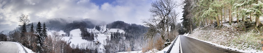 Winter landscape with road through the Black Forest near SImonswald