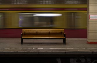 Empty bench and departing S-Bahn train at Nordbahnhof