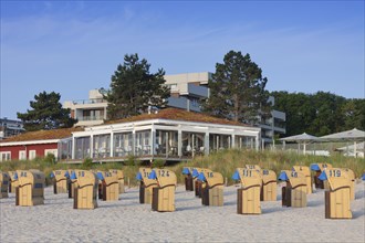 Restaurant and roofed wicker beach chairs along the Baltic Sea at Scharbeutz