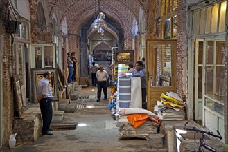Antiques and fabrics for sale in shops in the old historic bazaar of the city Tabriz
