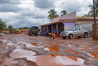 Grocery store along muddy dirt road in the village of Lethem during the rainy season