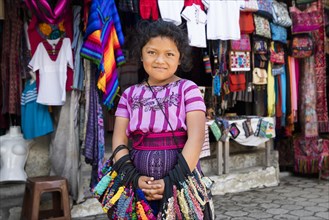 Young Mayan girl selling souvenirs in the town Santiago Atitlan at Lago de Atitlan