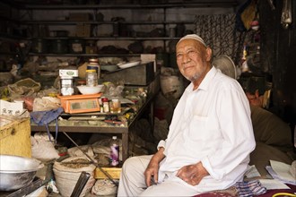 Arab vendor in his shop in the city Kashgar