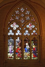 Colourful stained glass window depicting the birth of Jesus