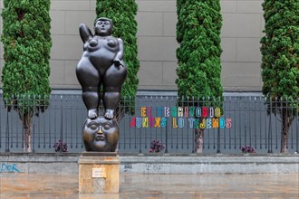 Botero sculpture and Botero sculptures in front of Palacio de la Cultura Rafael Uribe Uribe