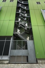 Green facade with external metal staircase in Kempten