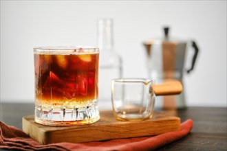 Espresso tonic on a wooden serving board