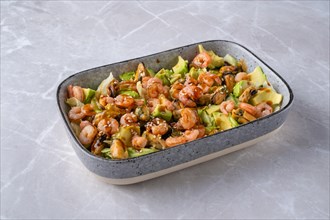 Bowl with iceberg lettuce salad with shrimp