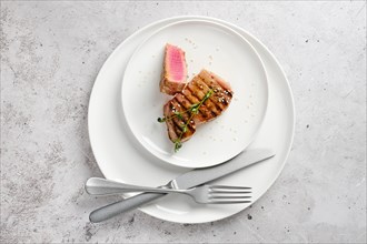Top view of plate with a portion of tuna steak