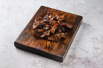 Serving board with fried beef bacon strips