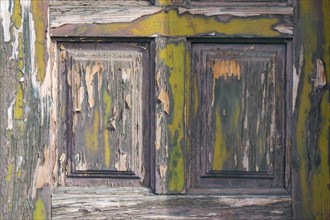 Old wooden door with peeling paint