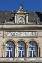 Detail of the municipal building Centre municipal on Place d'Armes with three windows and a clock on the roof